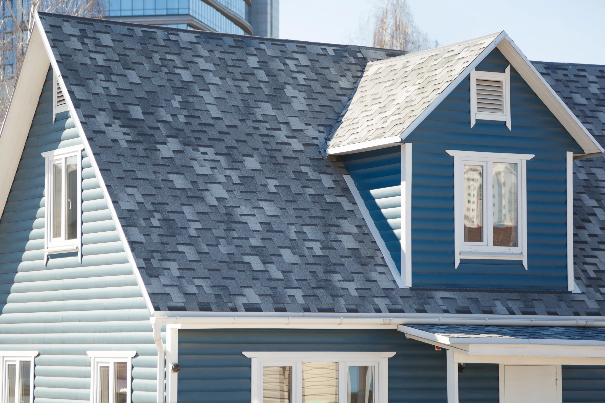 Certified contractor installing shingles during roof installation.